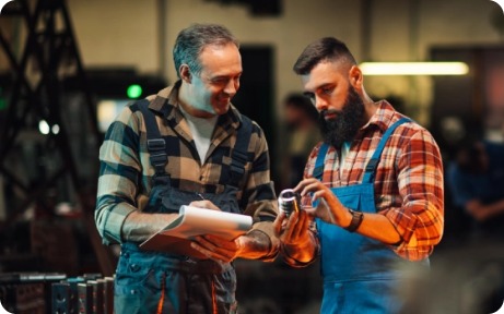 Industrial technicians reviewing equipment